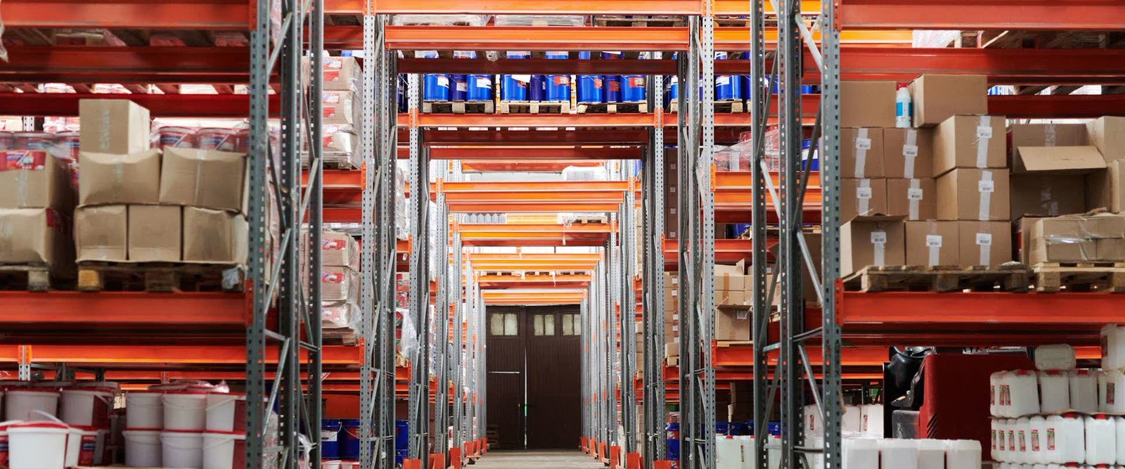 Warehouse racking aisle where parcels sent to your Indian address are received